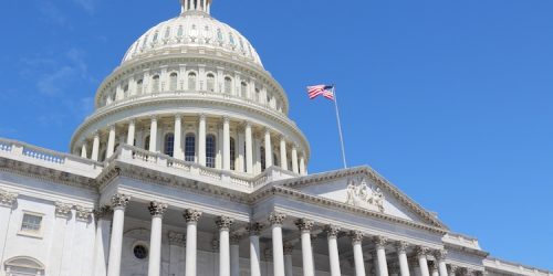 Washington DC, United States landmark. National Capitol building with US flag.