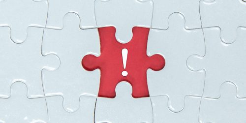 Missing a pieces of puzzle in the center, red space with exclamation mark icon.