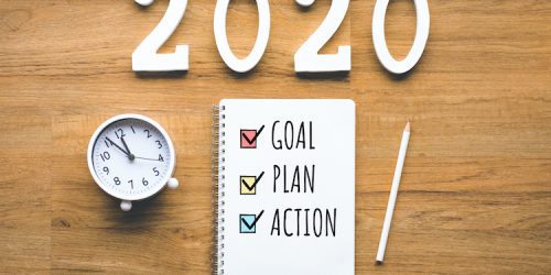 2020 new year goal,plan,action text on notepad on wood background.Business challenge.Inspiration ideas.Human performance