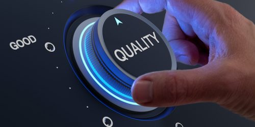 Selecting excellent quality to increase customer satisfaction. Quality assurance management and control for products or services. Concept with QA manager's hand turning knob.