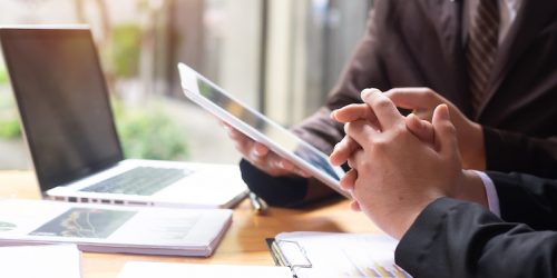Business working consult discussion on work table with tablet.